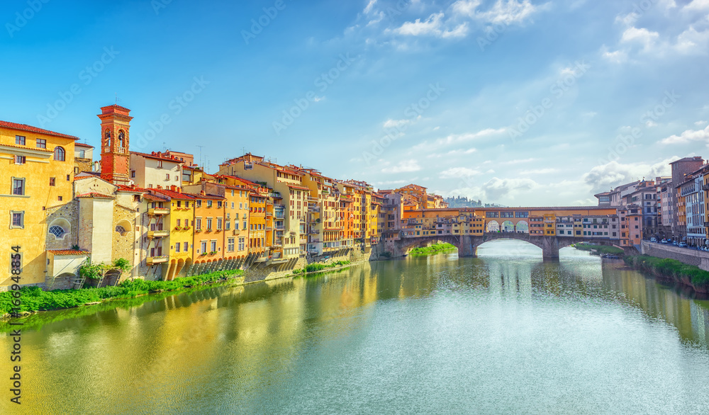 Obraz premium Ponte Vecchio is a bridge in Florence, located at the narrowest point of the Arno River, almost opposite the Uffizi Gallery.Italy.