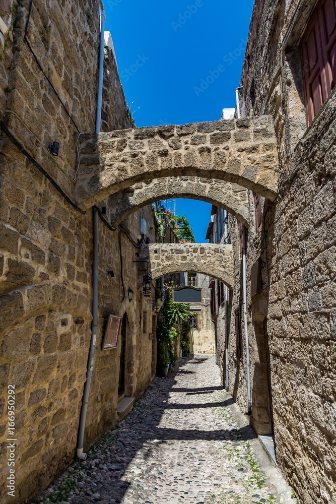 Charming narrow street at Rhodes old town, Rhodes island, Greece