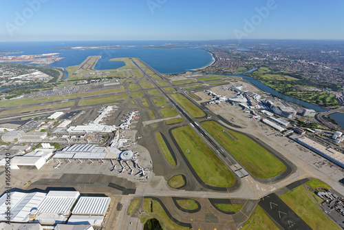 Sydney Airport, looking south-west over the Domestic and International Terminals towards Botany Bay