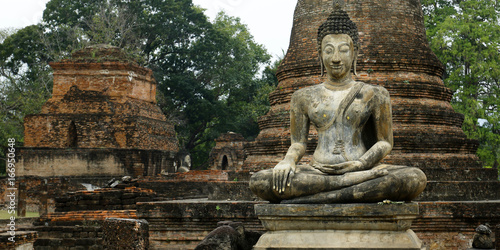 statue of buddha in the historical park of Sukhothai Thailand 