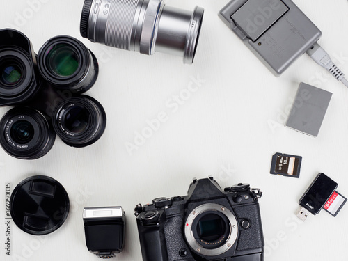 Equipment of photographer on white table