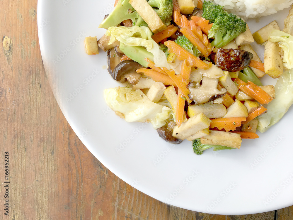 Stir Fried Tofu in Chinese Style, Deep Fried Tofu with Gravy Sauce ,Stir fried tofu with mixed vegetables and fried egg in white plate on white background. Vegetarian Food, healthy food. Stir Fried Tofu in Chinese Style, Deep Fried Tofu with Gravy Sauce ,Stir fried tofu with mixed vegetables and fried egg in white plate on white background. Vegetarian Food, healthy food.