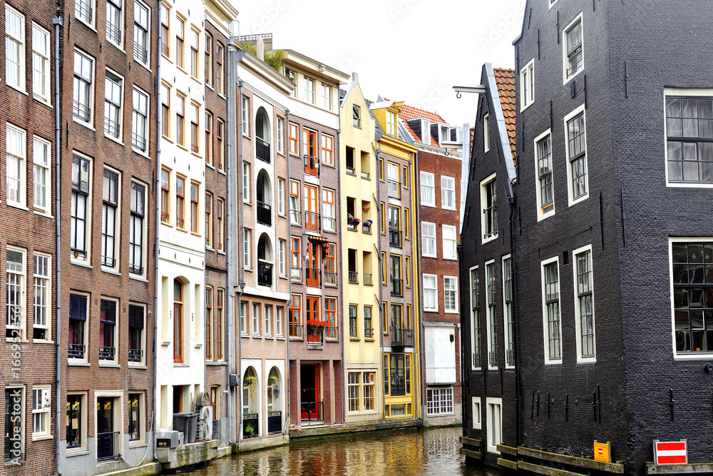 Scenic view of colorful buildings and canal in Amsterdam, Holland