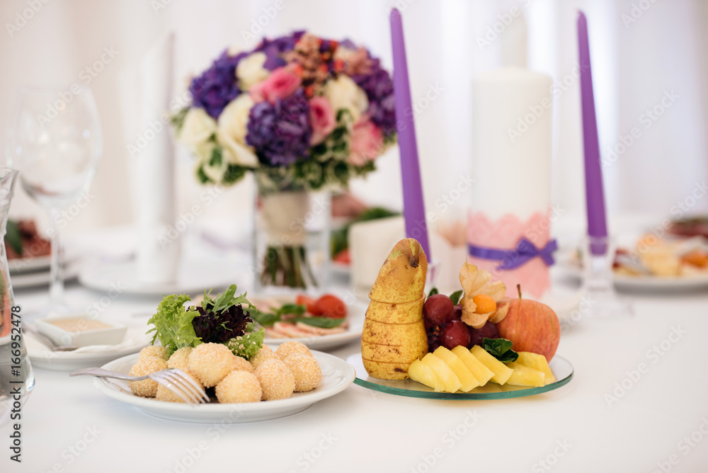 Sweets and fruits on banquet table Sweets and fruits on banquet table
