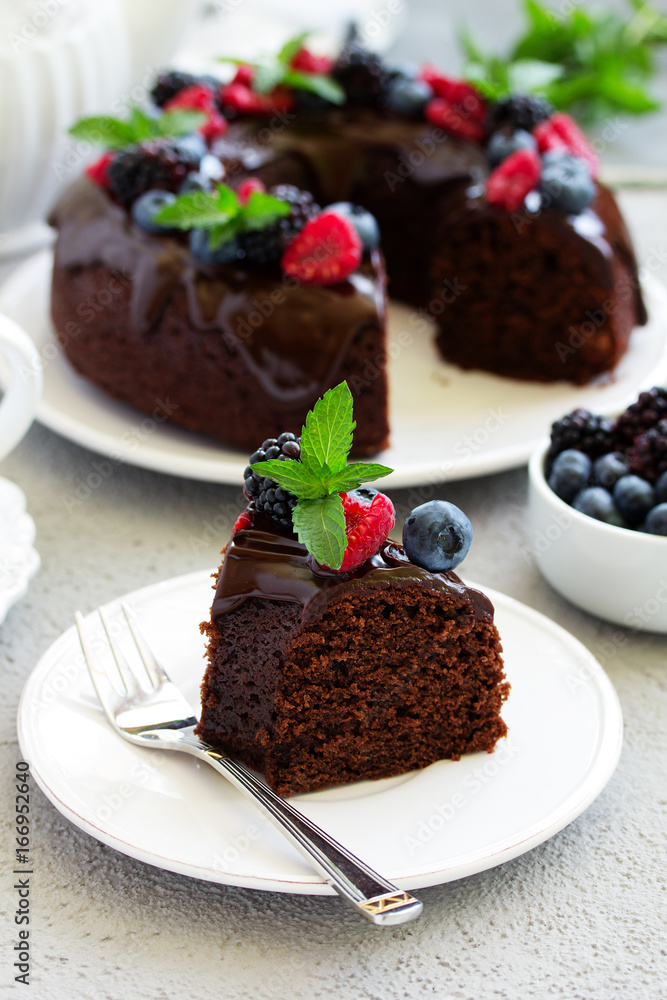 Chocolate cake with glaze and fresh berries Chocolate cake with glaze and fresh berries