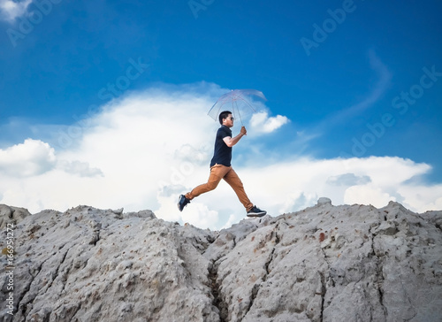 Man jump through the gap between hill.