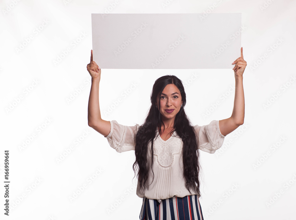 Young happy woman portrait of a confident businesswoman showing presentation, pointing placard gray background. Ideal for banners, registration forms, presentation, landings, presenting concept. Young happy woman portrait of a confident businesswoman showing presentation, pointing placard gray background. Ideal for banners, registration forms, presentation, landings, presenting concept.