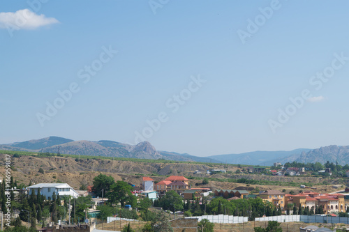 View of the seaside town Sudak in Crimea with mountains © Anastasia Gapeeva