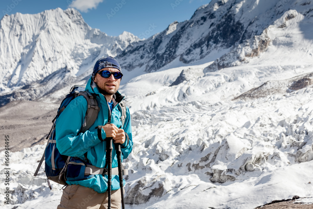 Hiker in highlands of Himalayas on Manaslu circuit Hiker in highlands of Himalayas on Manaslu circuit