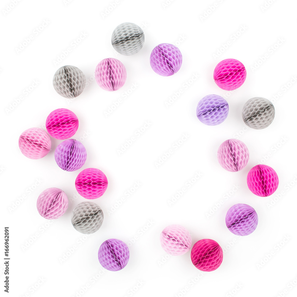 Creative arrangement frame of pink and lilac honeycomb balls with copy space for text. isolated on white background. Flat lay, top view. Creative arrangement frame of pink and lilac honeycomb balls with copy space for text. isolated on white background. Flat lay, top view.