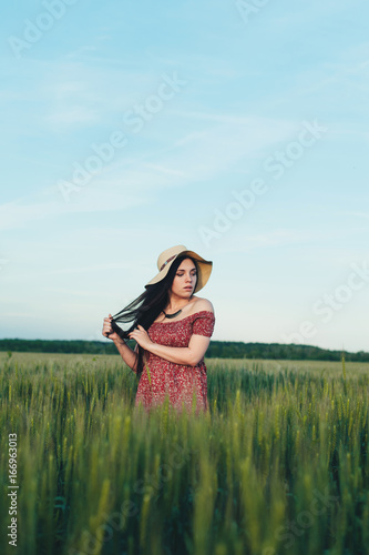Wallpaper Mural Beautiful young woman at sunset in the field Torontodigital.ca