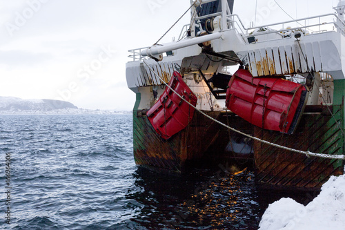 A Norwegian fishing boat parked in the port of Ålesund, Norway