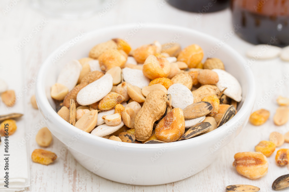 salted nuts and seeds on white dish salted nuts and seeds on white dish