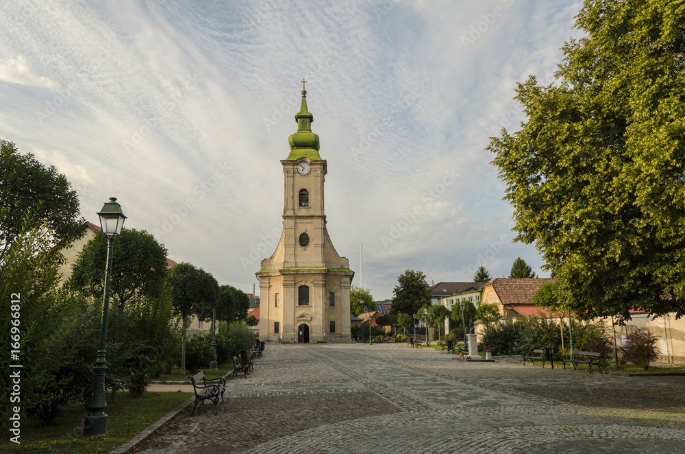 cloudy sky with a church in middle. scenic town image of church, July
