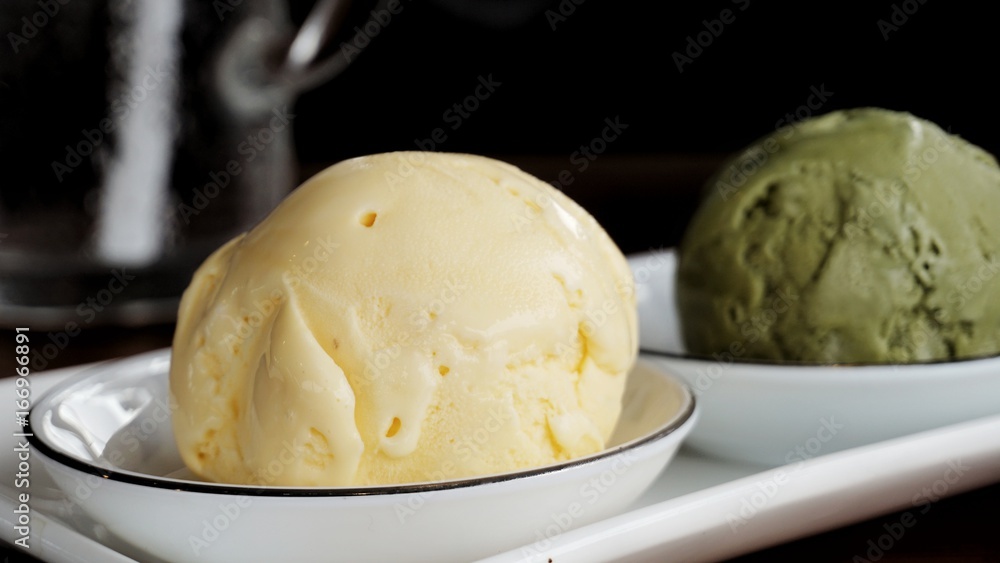 Vanilla and Green tea Matcha ice cream on white plate Vanilla and Green tea Matcha ice cream on white plate