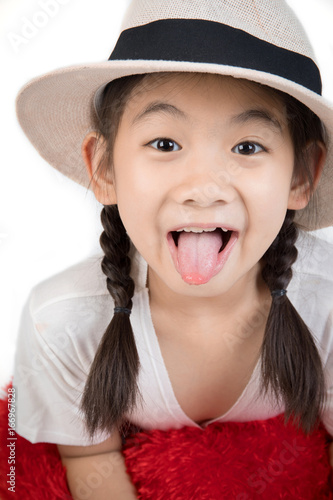 Headshot Portrait of happy cute girl show you tongue.