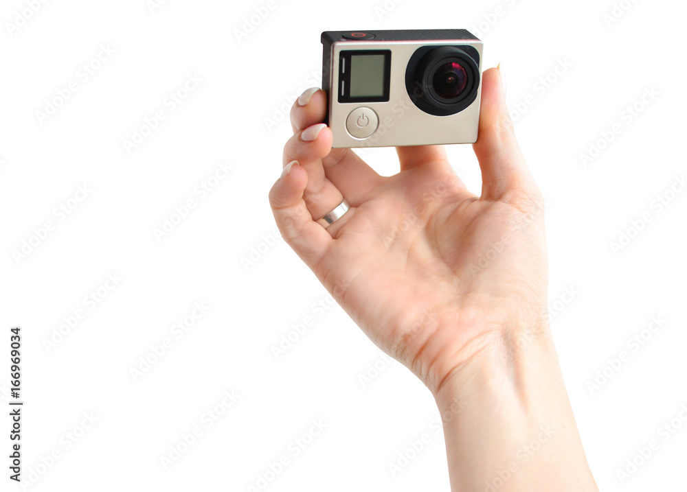 The hands of girl that makes selfie with an action camera The hands of girl that makes selfie with an action camera