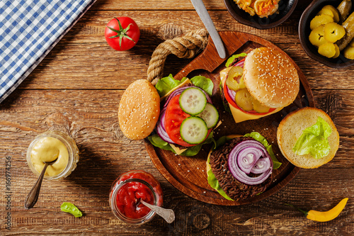 Homemade, beef hamburger with cheese and vegetables.