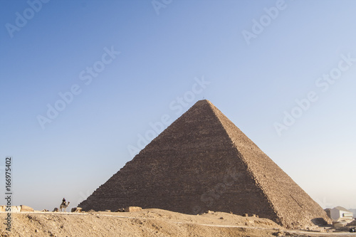 Giza  Cairo  Egypt - December 23  2006  Policemen on camels near the pyramids.