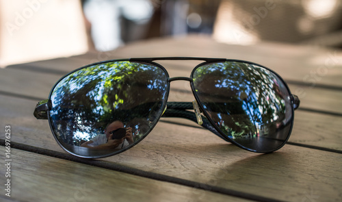 Sunglasses on the table © bisonov