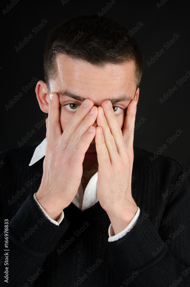 A handsome funny guy. Black background. Studio. A handsome funny guy. Black background. Studio.
