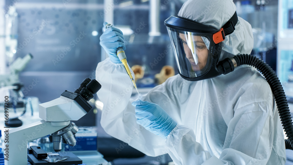Medical Virology Research Scientist Works in a Hazmat Suit with Mask ...