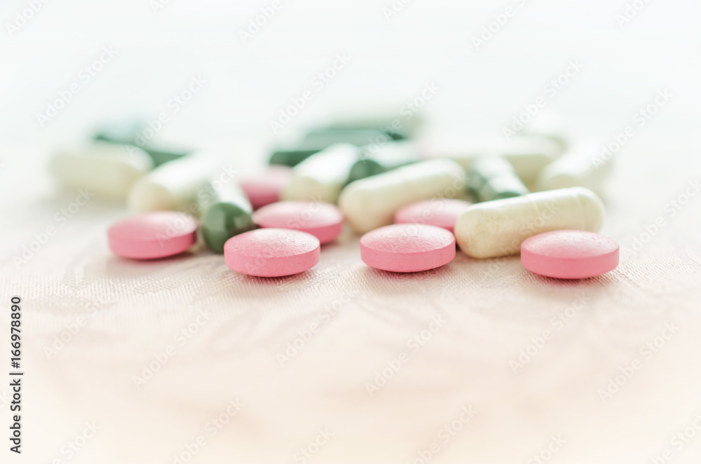 Pink, white and green pills tablets medicine Pink, white and green pills tablets medicine