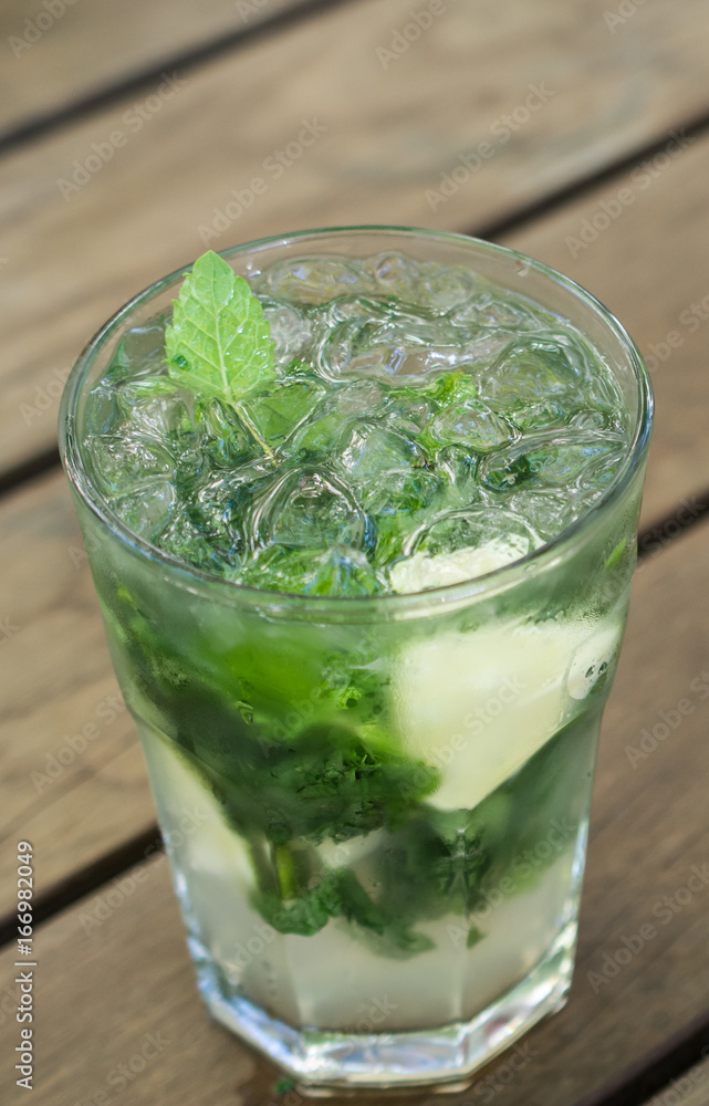 Mojito on a wooden table, fresh drink Mojito on a wooden table, fresh drink