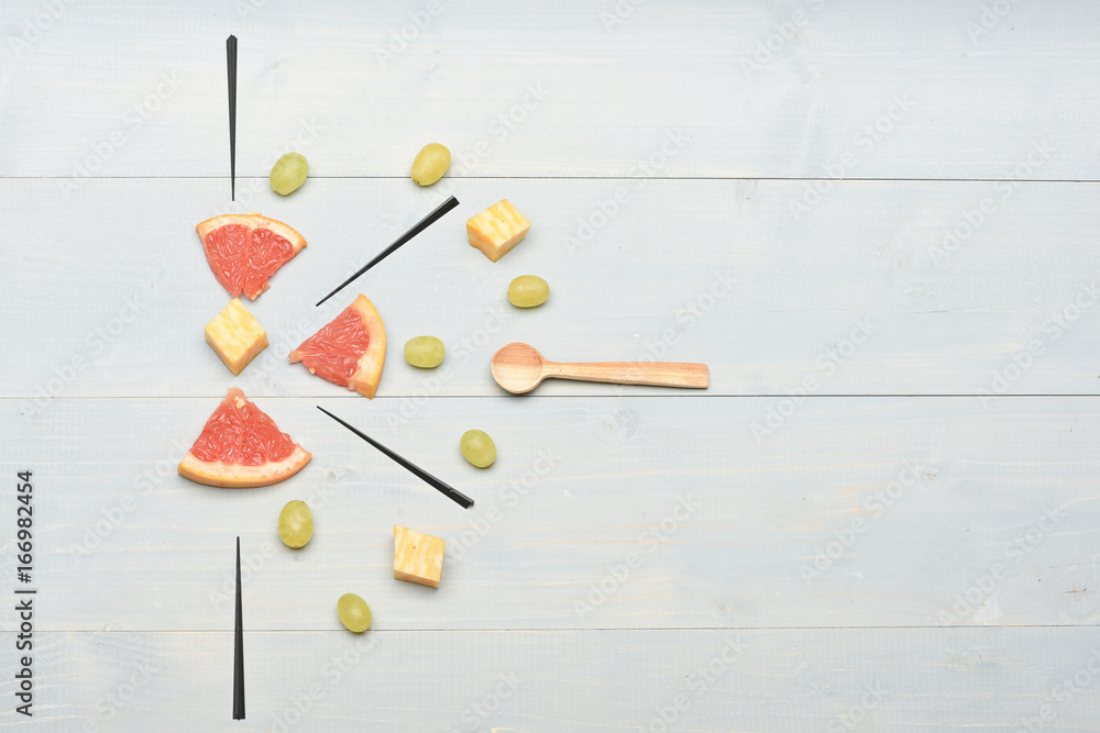Delicious snack with cheese and grapefruit, top view Delicious snack with cheese and grapefruit, top view