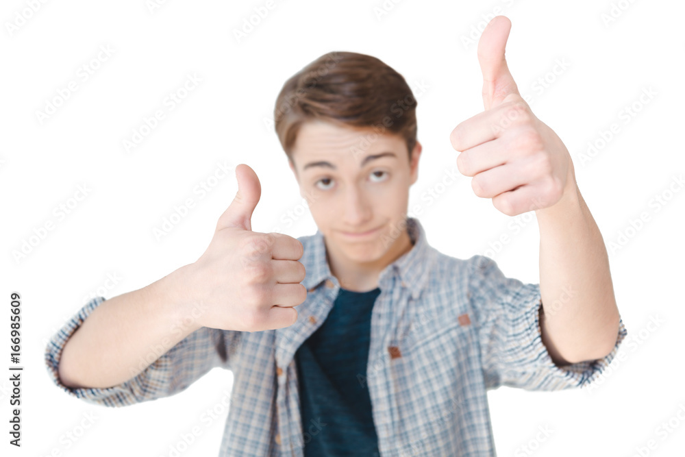 selective focus of caucasian teenager showing thumbs up isolated on white selective focus of caucasian teenager showing thumbs up isolated on white
