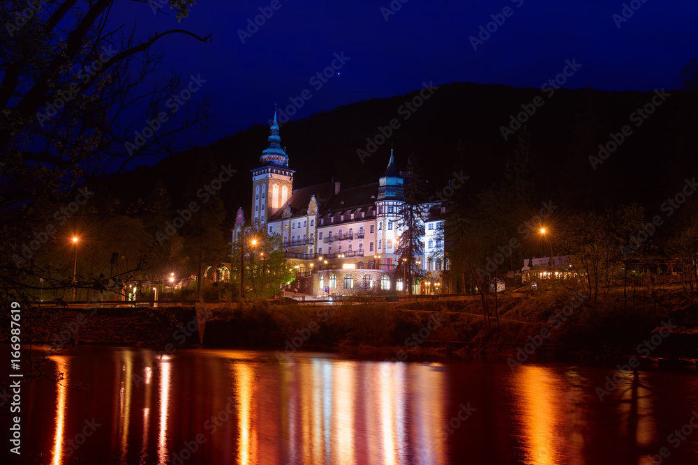 Lillafured palace in Miskolc, Hungary in the night. Lake Hamori in foreground with reflections. Travel outdoor landmark background