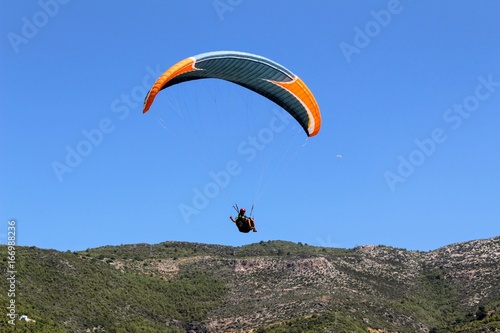 Paraglider landing in a special zone at Cleopatra Beach in Alanya (Turkey).