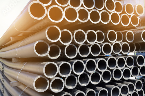 Plastic pipes in stock of finished products stacked in packs