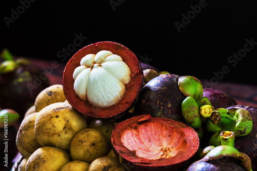 Mangosteen fruits in dark tone photo