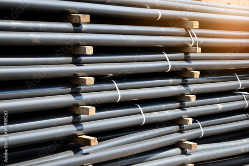 Plastic pipes in stock of finished products stacked in packs