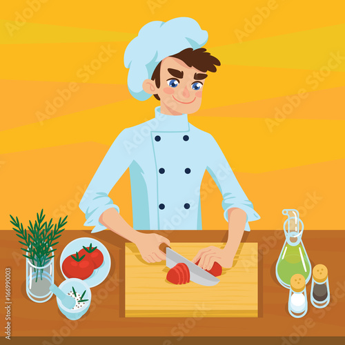 Happy young cook slicing tomato on chopping board.