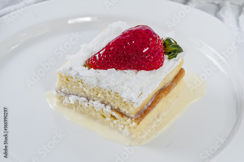 Piece of Vanilla cake With Strawberry In Plate