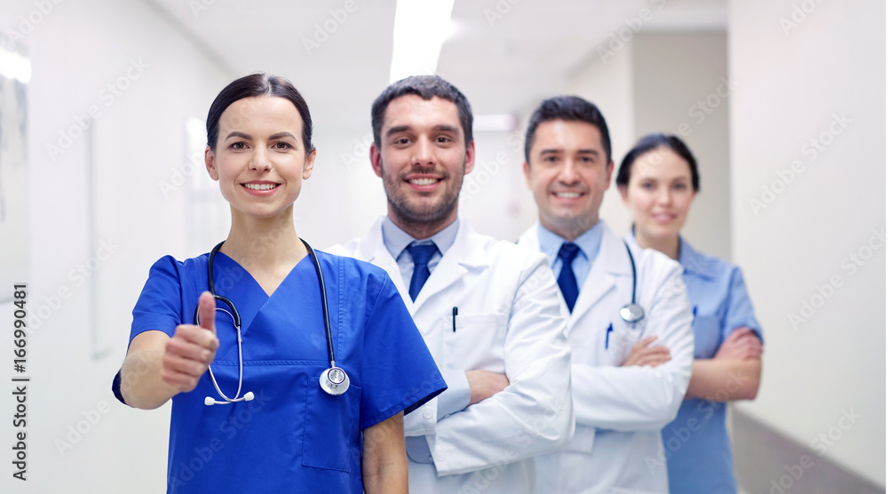 medics or doctors at hospital showing thumbs up medics or doctors at hospital showing thumbs up