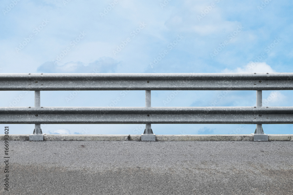 railing at road side on blue sky background railing at road side on blue sky background