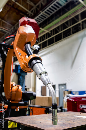 Close-up robot arm is ready to welding in factory
