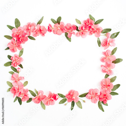 Fototapeta Naklejka Na Ścianę i Meble -  Floral frame with space for text made of pink hydrangea flowers, green leaves, branches on white background. Flat lay, top view. Floral background. Frame of flowers.