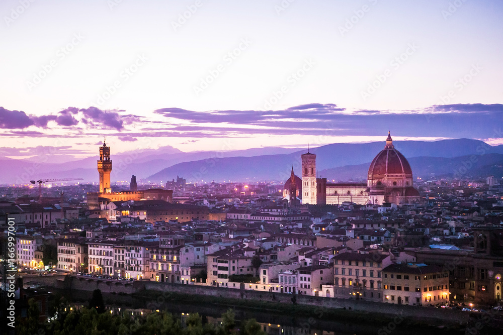 Italy, Florence. View of the Cathedral of Santa Maria del Fiore and Palazzo Vecchio from the Piazzale Michelangelo. Evening, sunset.