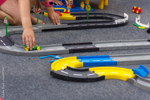 Toy designer for children car road. The child collects a puzzle road.