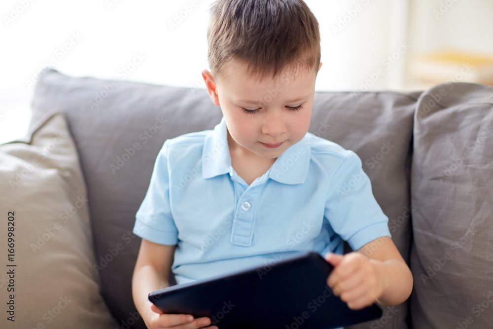 little boy with tablet pc computer at home little boy with tablet pc computer at home