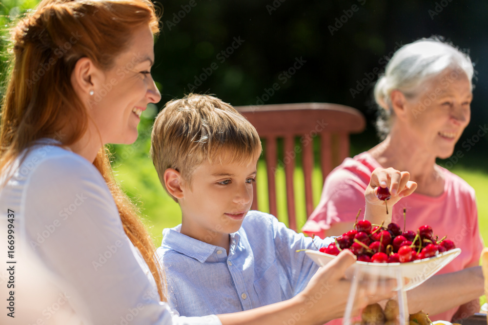 happy family having dinner or summer garden party happy family having dinner or summer garden party