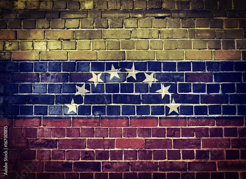 Grunge Venezuela flag on a brick wall