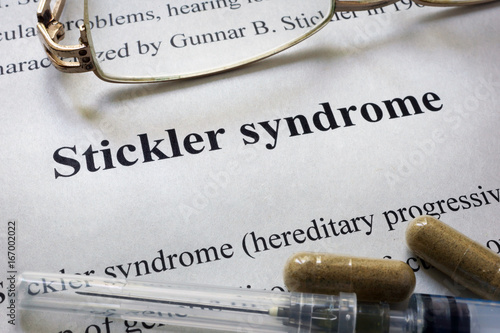 Paper with words Stickler syndrome  and glasses. Medical concept.