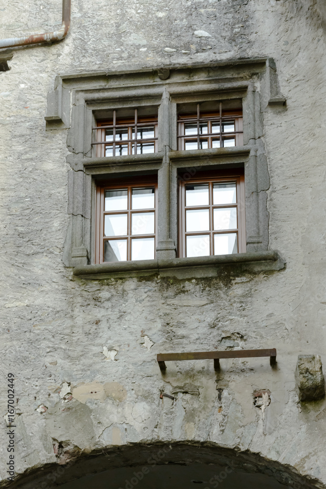 stone framed window in medieval village of Bard, Italy