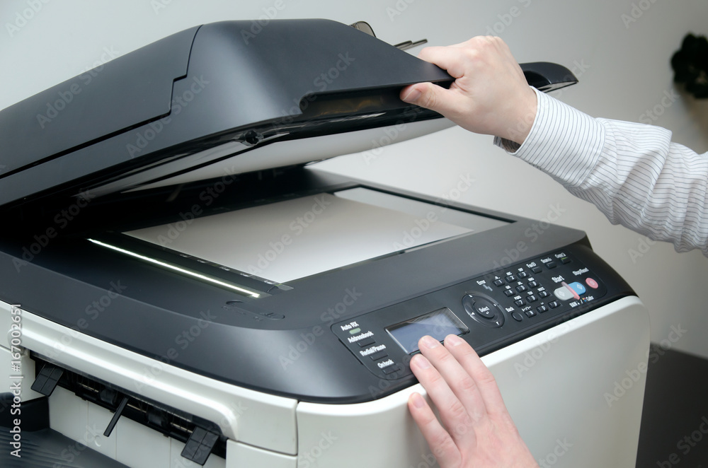 Man using scanner device in office Man using scanner device in office