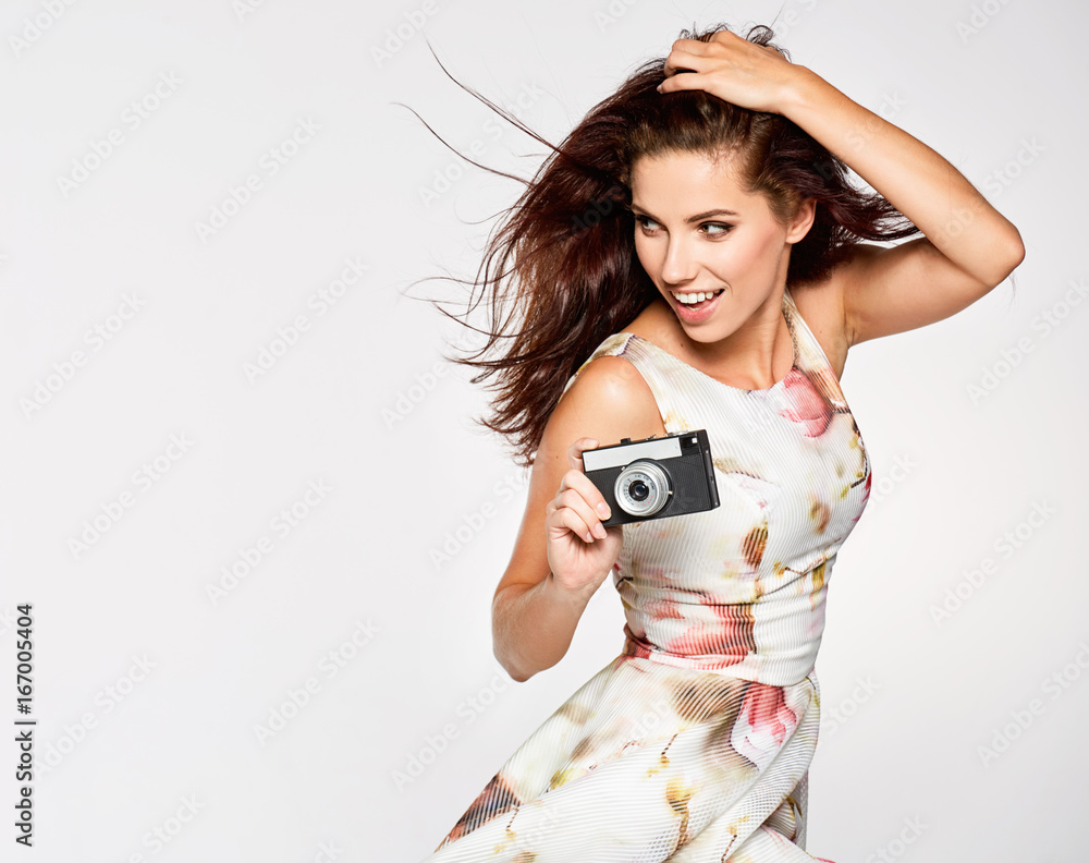 Premium Photo | Stylish curly-haired girl poses for the camera